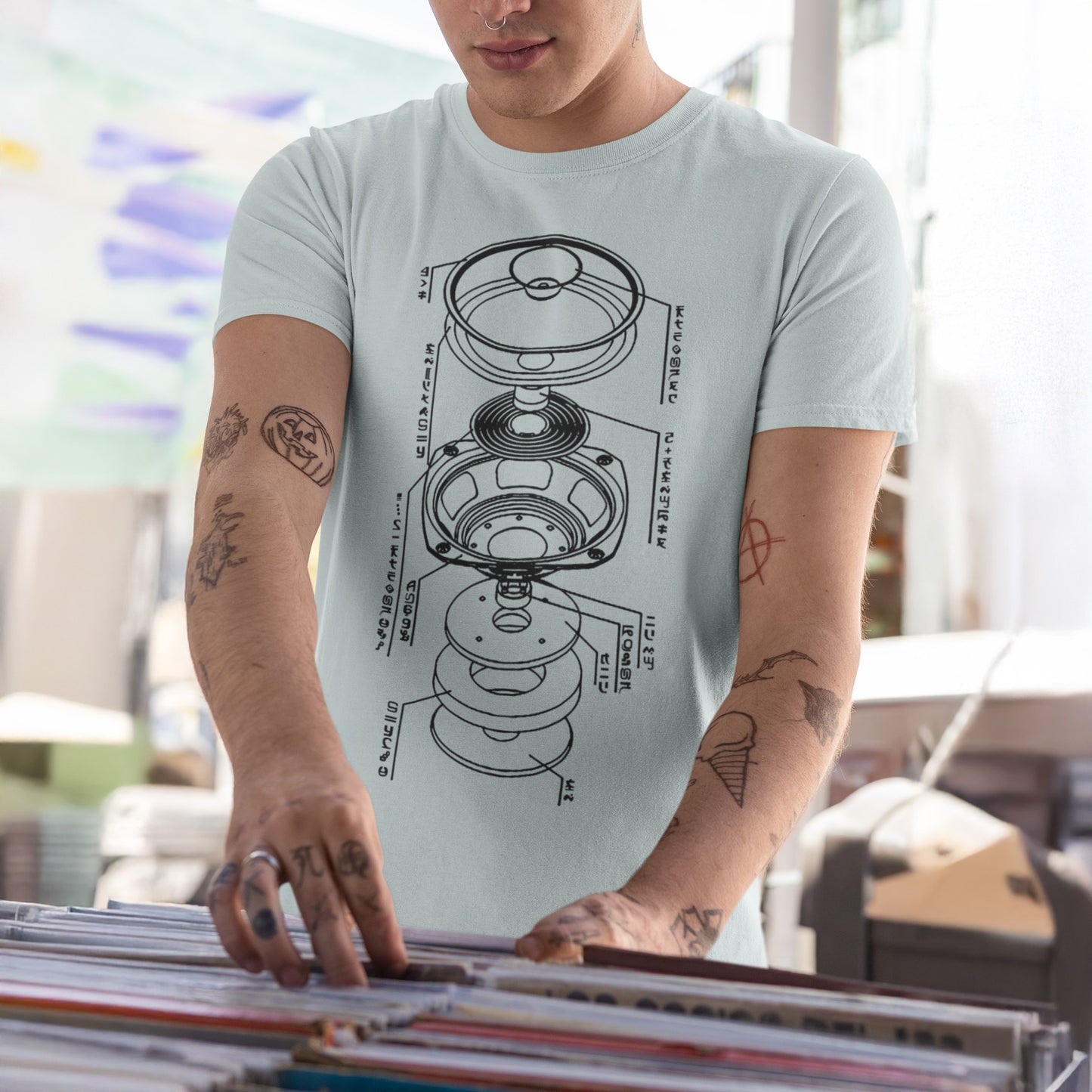 A man wearing Alien Subwoofer Technology Tee, heather prism ice blue