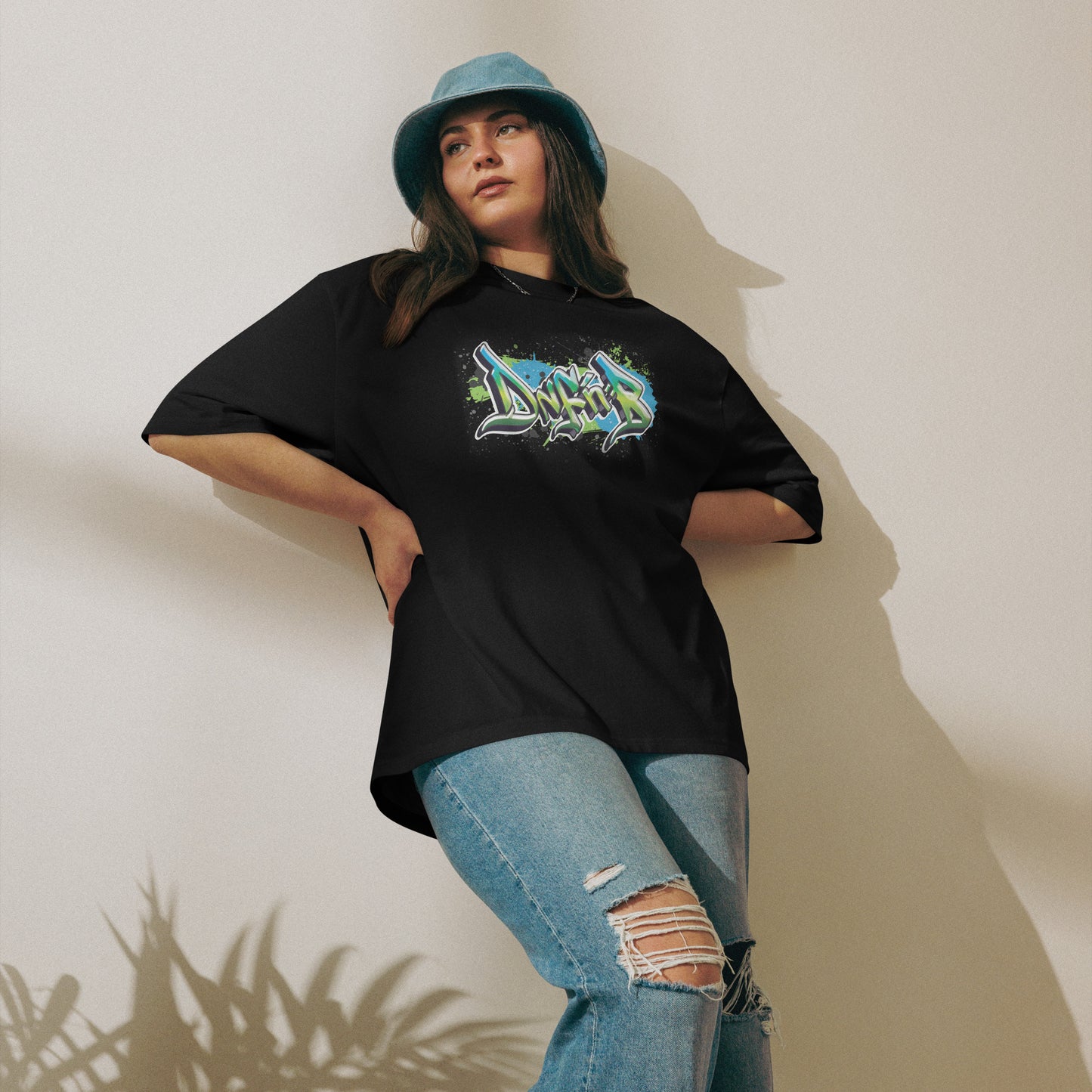 A woman wearing DnF'nB Oversized Graff Tee, black