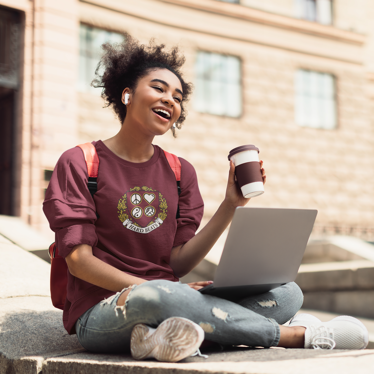 A woman wearing Hard Beats University Unisex Sweatshirt, maroon