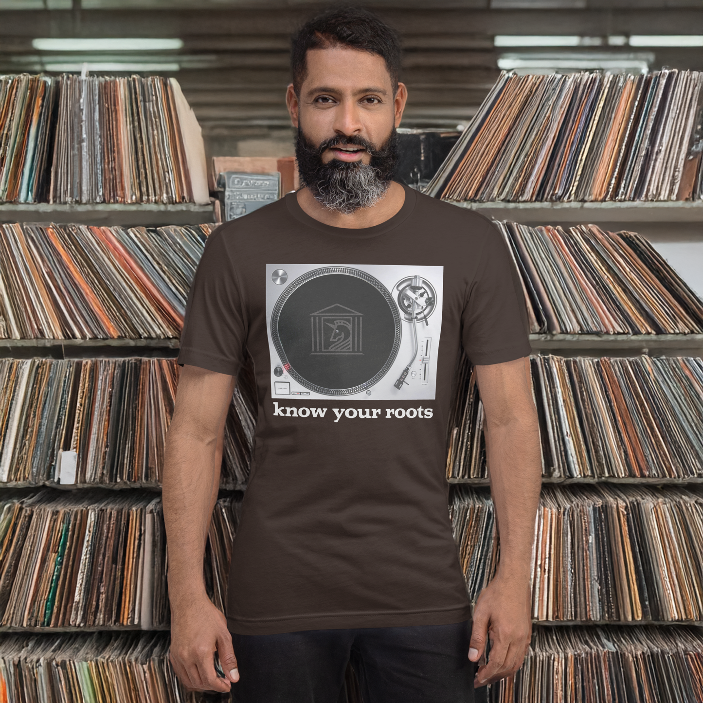A man wearing Know Your Roots Turntable Tee, brown