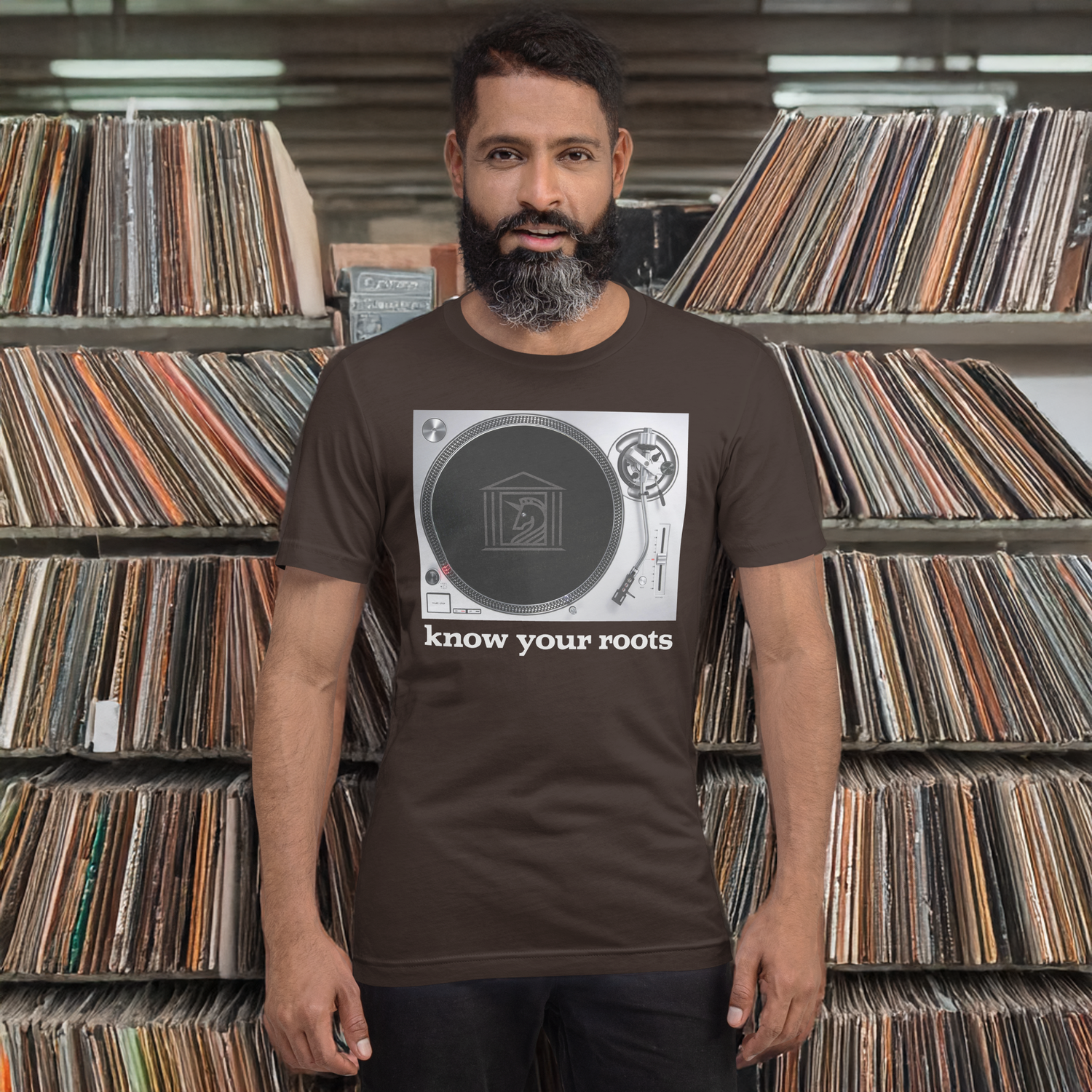 A man wearing Know Your Roots Turntable Tee, brown