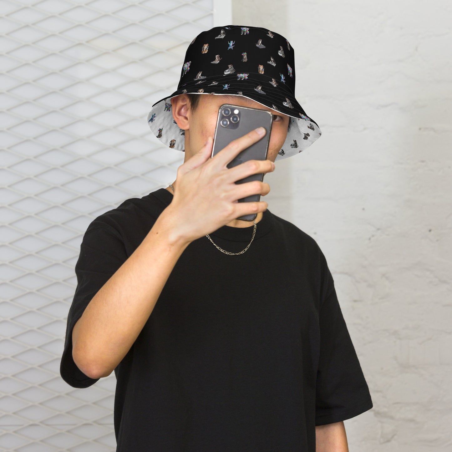 A man wearing Rave Cats Reversible Bucket Hat, black side