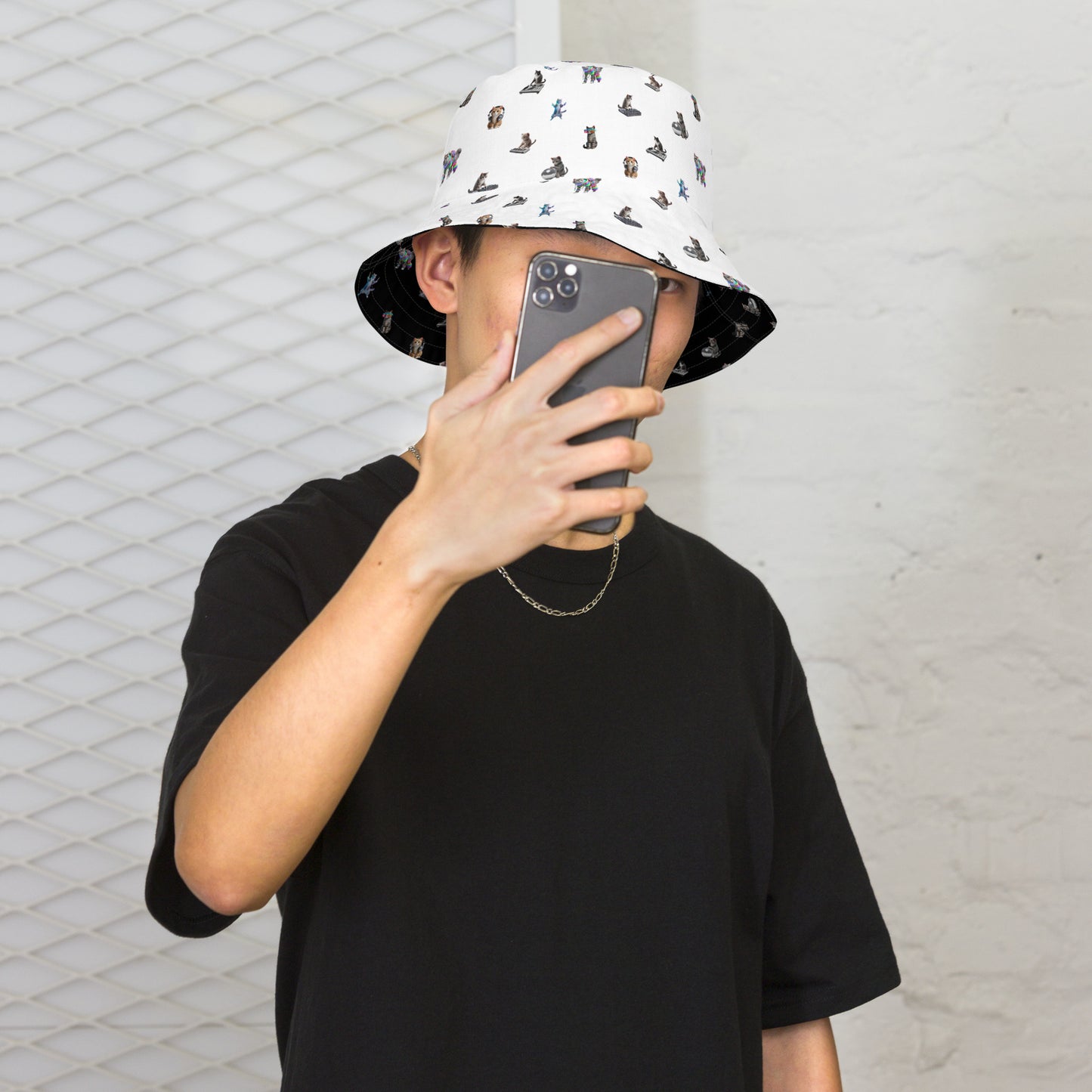 A man wearing Rave Cats Reversible Bucket Hat, white side