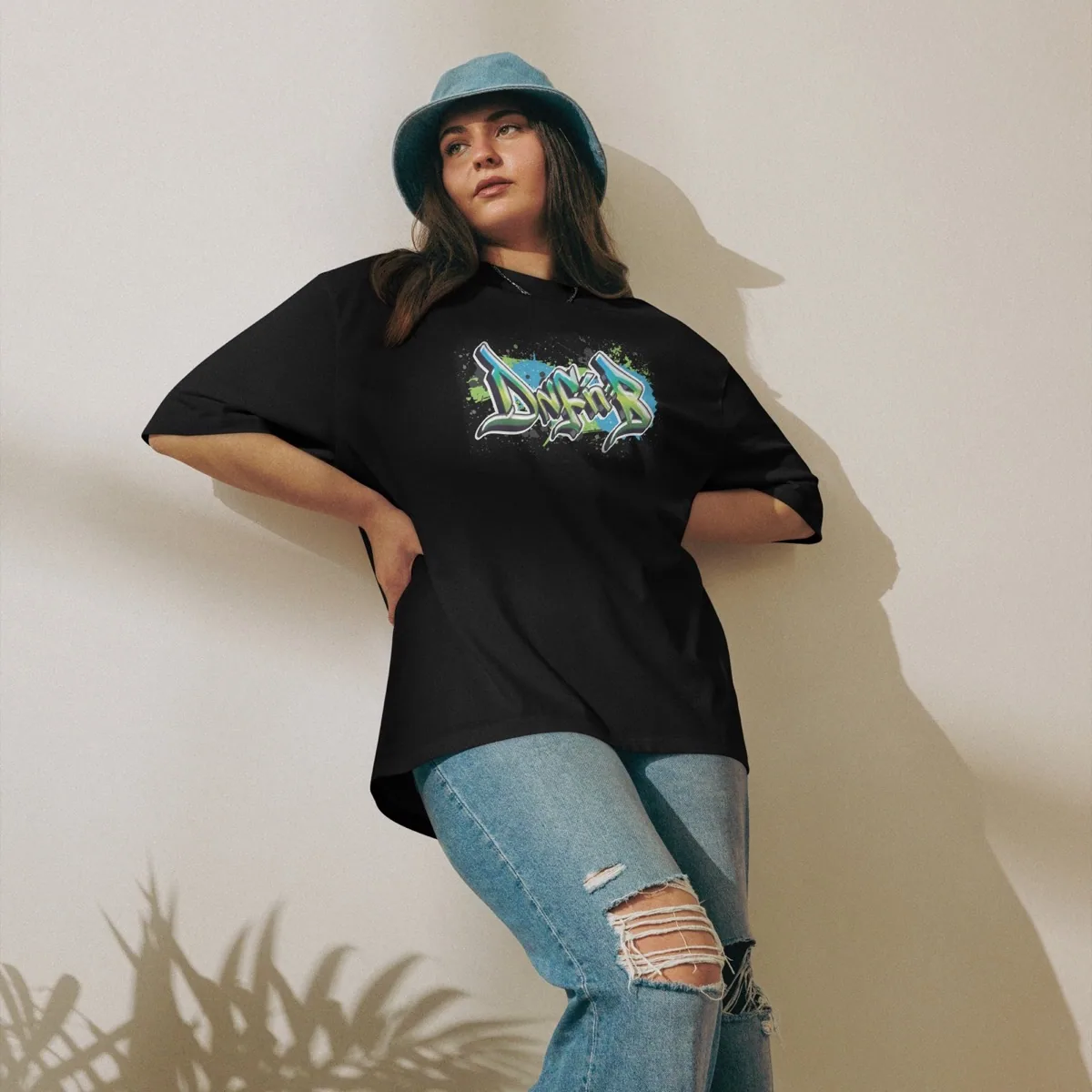 A woman wearing DnF'nB Oversized Graff Tee, black
