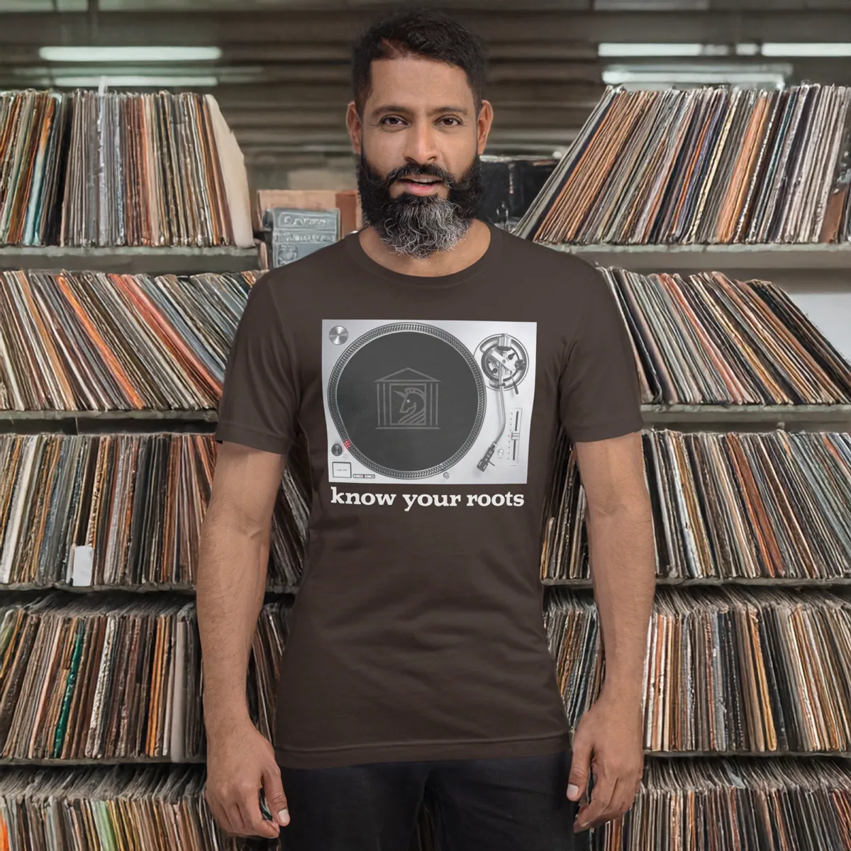 A man wearing Know Your Roots Turntable Tee, brown