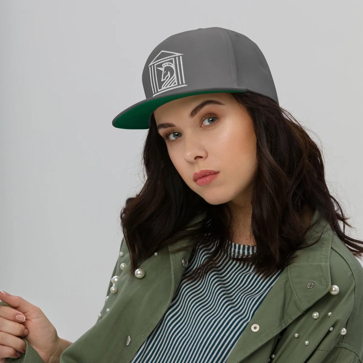 A woman wearing Temple of Unicorns Flat Bill Snapback, grey